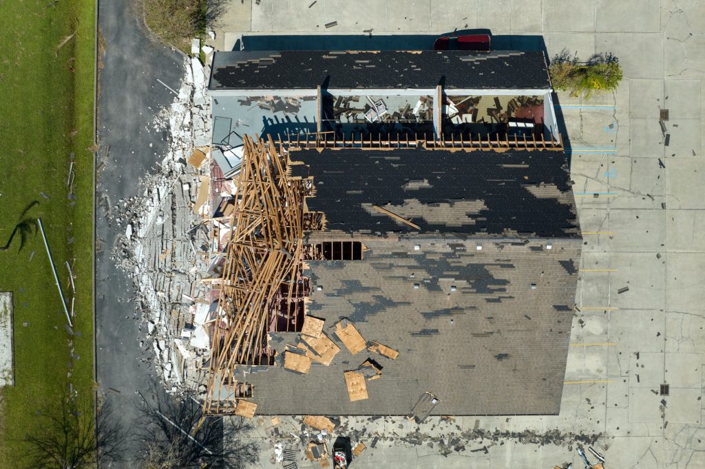 Natural disaster and its consequences. Hurricane Ian destroyed house roof